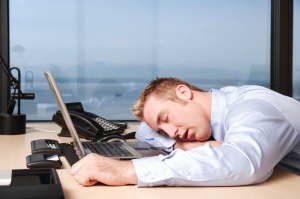 man-asleep-on-desk